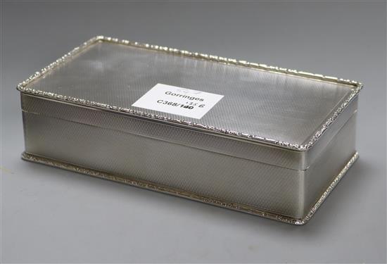 A 1960s engine tuned silver cigarette box, Birmingham, 1964, 17.2cm.